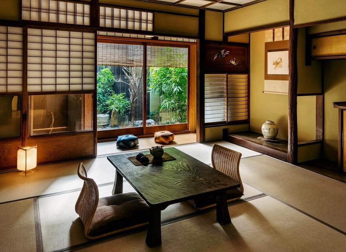 Warm Japanese-inspired living room with natural wood and garden view